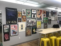 an office with many posters on the wall