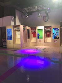 a display of soccer shirts in a room